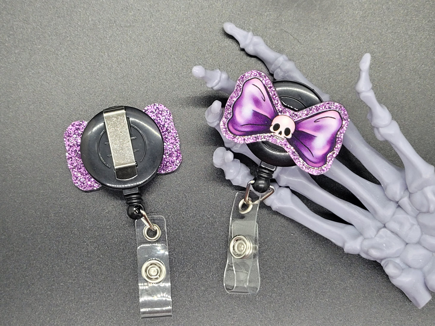 Purple Glitter Acrylic Badge Reel Skull Bow