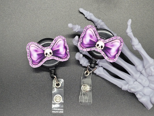 Purple Glitter Acrylic Badge Reel Skull Bow